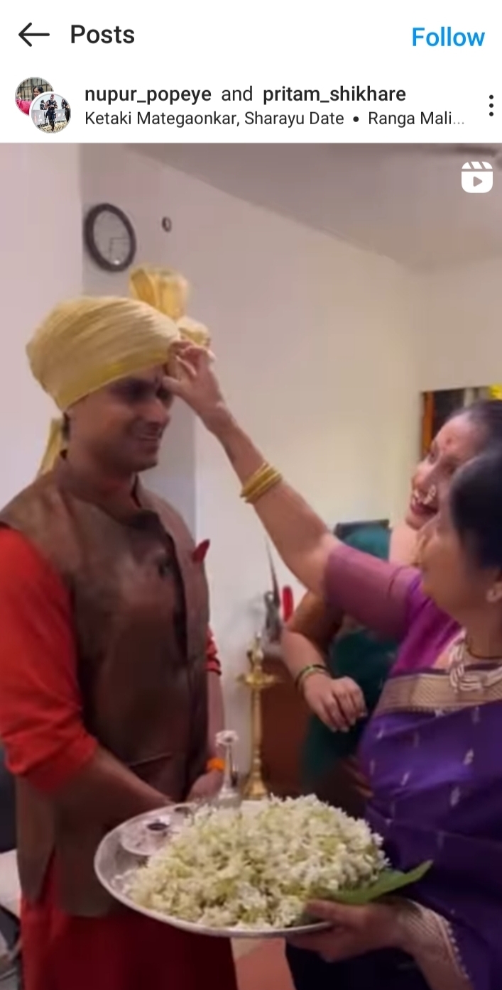 Nupur's mom giving Tilak 